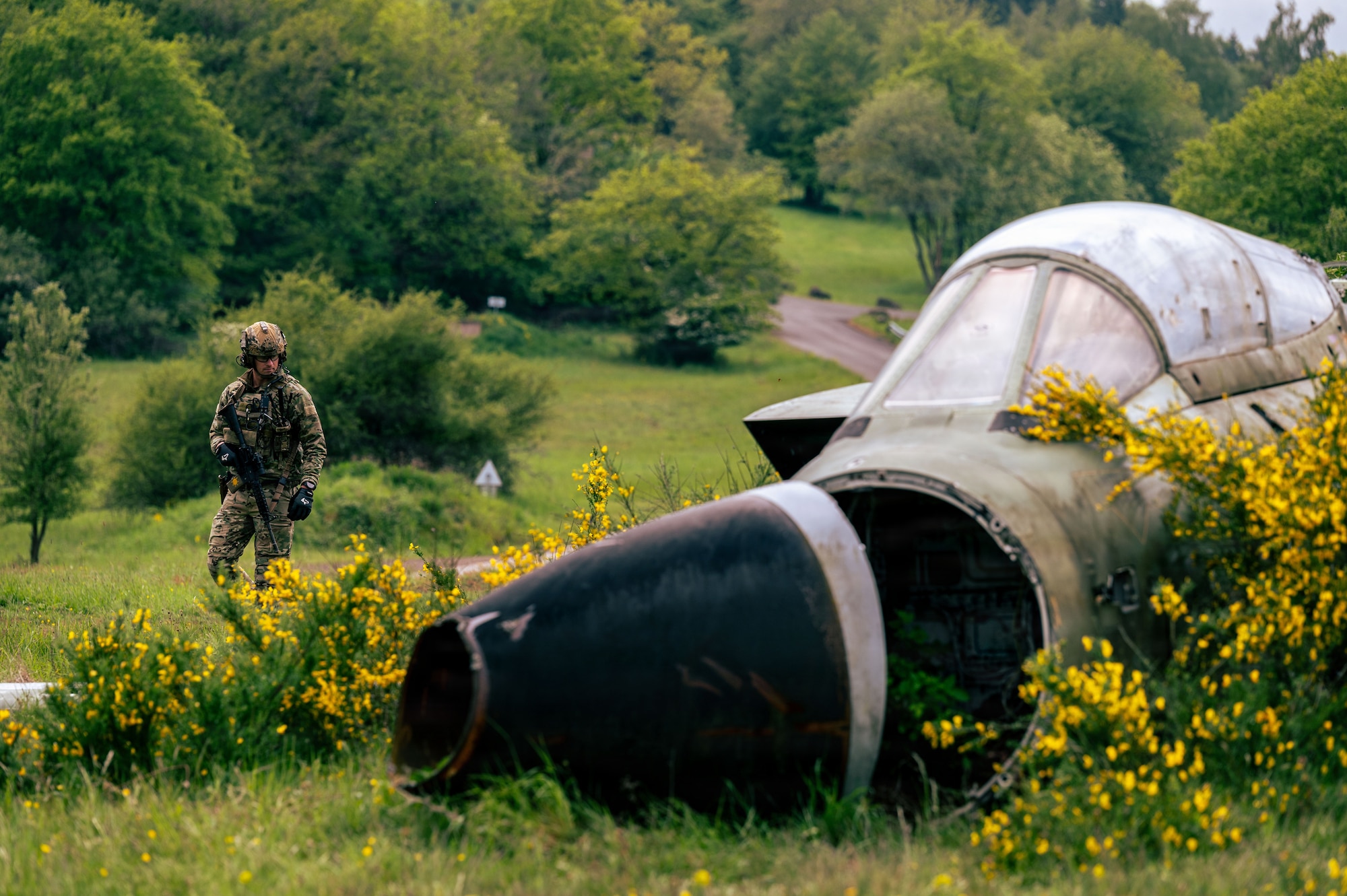 U.S. Air Force Staff Sgt. Adam Bell, 45th Civil Engineer Squadron Explosive Ordnance Disposal flight team member, secures the perimeter
