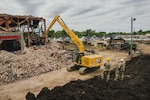 An Indiana National Guardsman with the 113th Engineer Battalion operates an excavator to demolish a building as part of an Innovative Readiness Training, or IRT, in partnership with the city of Terre Haute, Indiana, May 8, 2026. IRT is a collaborative program that leverages military contributions and community resources to multiply value and cost savings for participants. These missions simultaneously enhance military readiness and deliver vital infrastructure benefits to U.S. communities. Photo by Staff Sgt. Hector Tinoco.