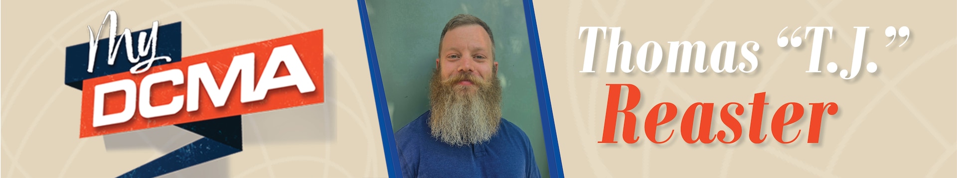 Smiling man with a beard wears a blue shirt
