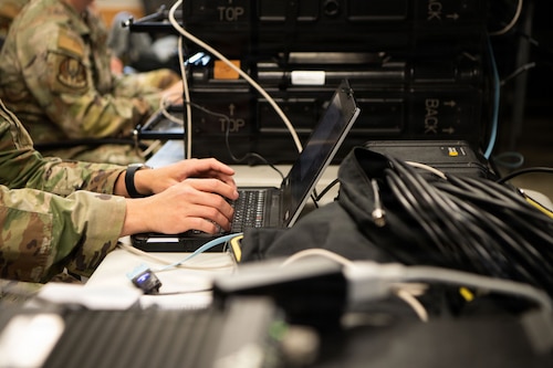 Air Commandos execute a training scenario on a TSR-11 tactical ground receive suite communications system.