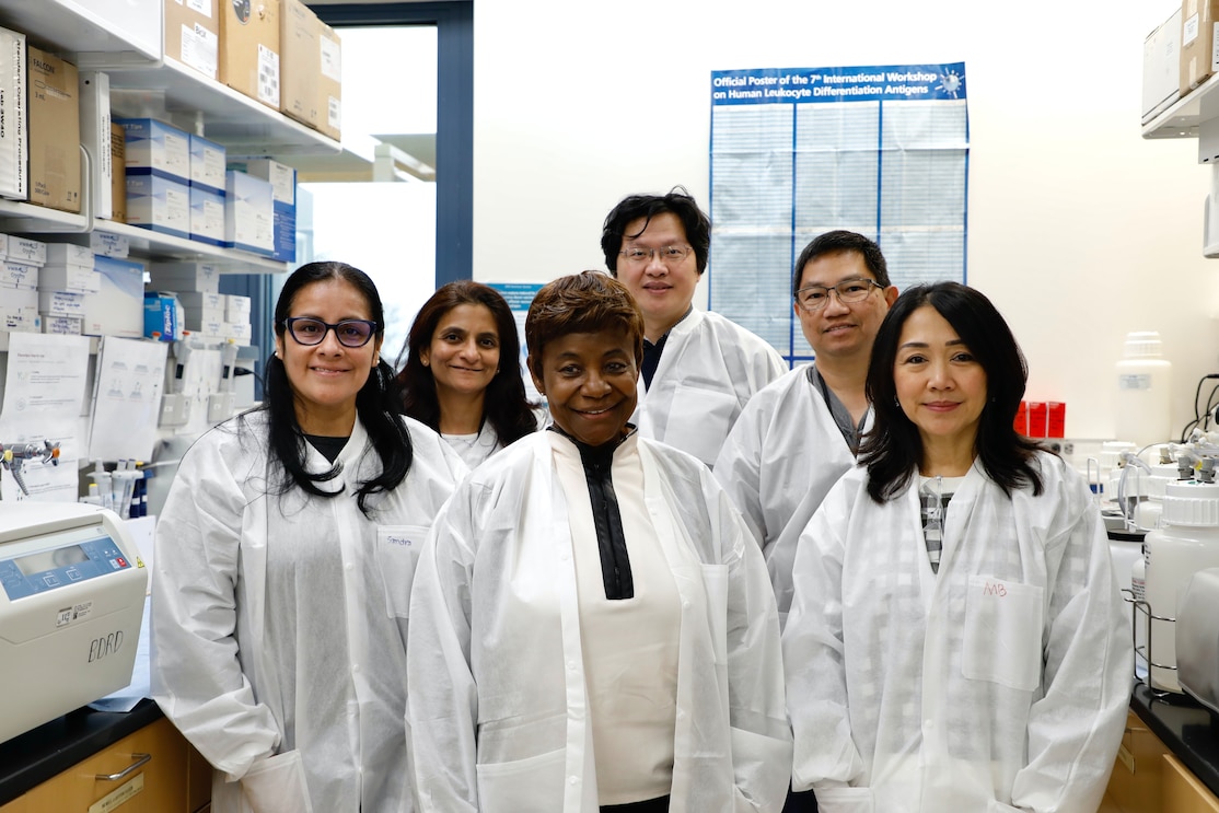 Researchers with Naval Medical Research Command (NMRC) pose for a group photo in the Agile Vaccines and Therapeutics (AVAT) laboratory.
