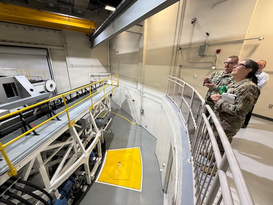 Lt. Cmdr. Travis Landry provides a capabilities demonstration of the Disorientation Research Device, or Kraken, to U.S. Air Force Col. Dorinda Mazza, 88th Air Base Wing vice commander during a visit to Naval Medical Research Unit Dayton May 11 on Wright-Patterson Air Force Base, Ohio. This research directly supports Landry's personal mission to to mitigate risks and provide as much safety as possible for forward-deployed service members.