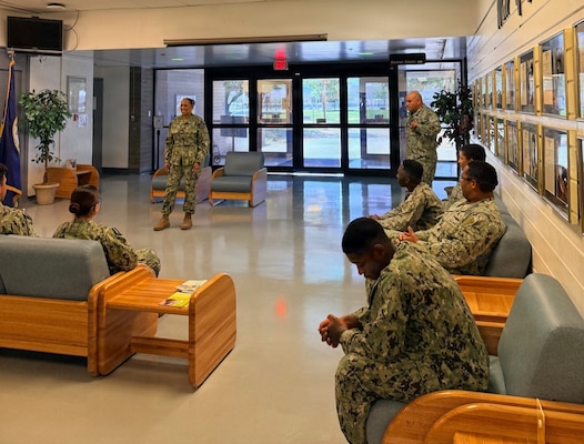 Capt. Janiese Cleckley (left), commanding officer of Navy Medicine Readiness and Training Command Twentynine Palms and director of Naval Hospital Twentynine Palms, and Master Chief Richard Moreno (right), NMRTC Twentynine Palms command master chief and Naval Hospital Twentynine Palms senior enlisted leader, speak with Sailors assigned to Navy Medicine Readiness and Training Unit China Lake and Branch Health Clinic China Lake during a leadership visit at Naval Air Weapons Station China Lake, California, April 28, 2026. The visit focused on operational readiness, staff development, patient care, and reinforcing Navy Medicine’s mission to maintain a medically ready force and ready medical force. (U.S. Navy photo by Hospital Corpsman 3rd Class Rebecca Duran)