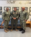 Hospital Corpsman 1st Class Brian Romero (center), a search and rescue medical technician assigned to Navy Medicine Readiness and Training Unit China Lake, poses for a photo with Capt. Janiese Cleckley (left), commanding officer of Navy Medicine Readiness and Training Command Twentynine Palms and director of Naval Hospital Twentynine Palms, and Master Chief Richard Moreno during a leadership visit to Branch Health Clinic China Lake at Naval Air Weapons Station China Lake, California, April 28, 2026. Romero recently supported NASA’s Artemis II mission as part of a search and rescue medical team, highlighting the operational reach and expeditionary capabilities of Navy Medicine personnel. (U.S. Navy photo by Hospital Corpsman 3rd Class Rebecca Duran)