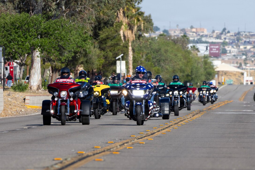 Marine and civilian personnel waved on veteran motorcycle riders with salutes and American flags along Route 66/Joseph L. Boll during their annual Run for the Wall ride from California to the Vietnam Memorial wall in DC aboard Marine Corps Logistics Base Barstow, California, May 13. These riders run various routes and joint the convoy along the way so by the time they meet at the Wall, there are thousands to remember those that can't ride for themselves by Memorial Day. 
A message from Sergeant Major Mario Virto, base sergeant major, stated: 
“In the Marine Corps, we talk a lot about legacy, tradition, and taking care of our own. This event was a living demonstration of those values. The riders who came through our base are riding for a cause that strikes at the very heart of the warfighter's ethos: the sacred promise that we will never forget our Killed in Action, and we will never stop advocating for a full accounting of our Prisoners of War and Missing in Action (POW/MIA). By lining that route as one unified base family, you sent a clear message to those nearly 200 riders—and to the 12th Sergeant Major of the Marine Corps, Harold G. Overstreet—that their brothers and sisters still in the fight stand firmly behind them. You helped provide a moment of healing and respect for veterans who have sacrificed deeply for our nation.”