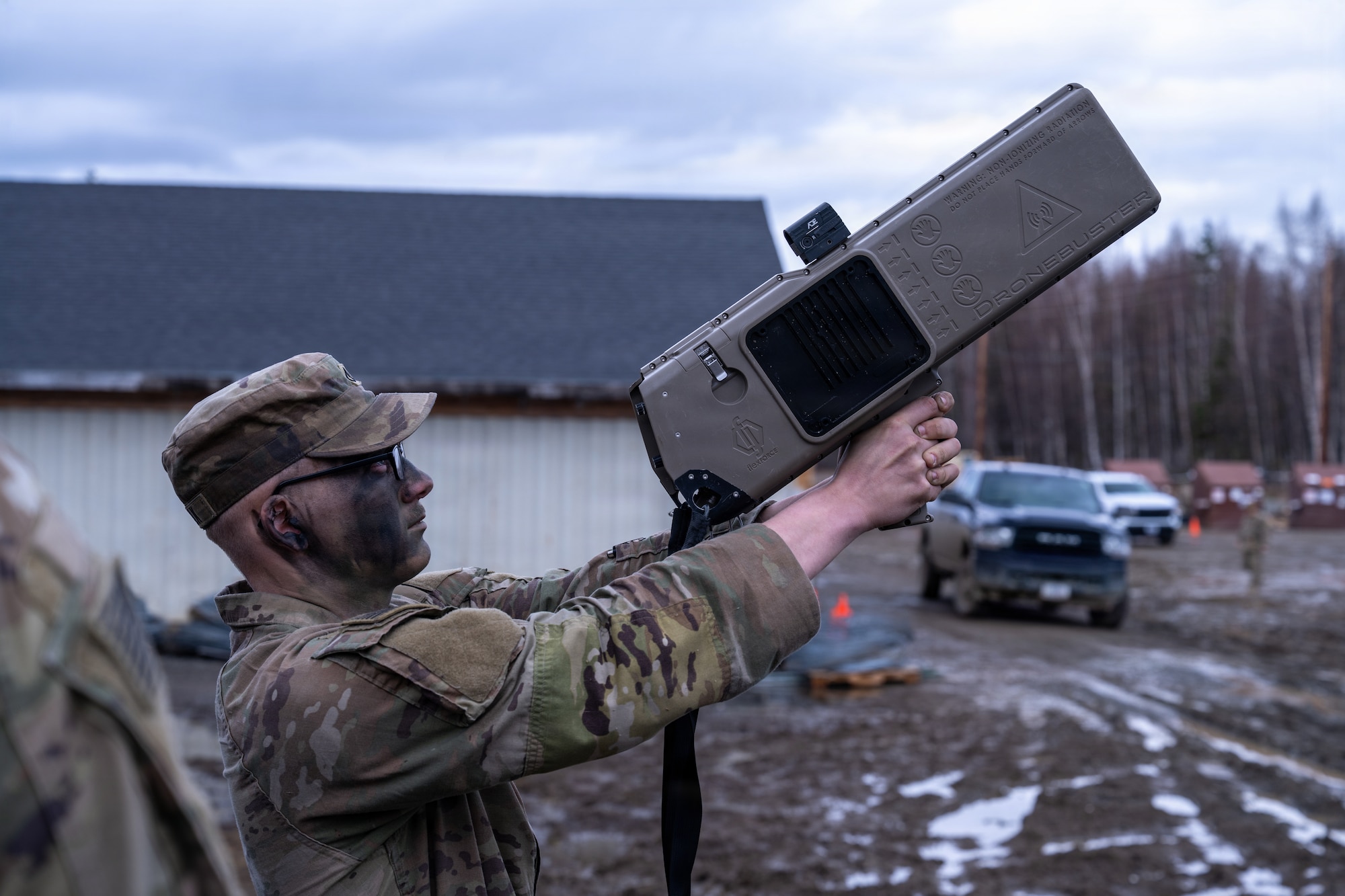 U.S. Army Pfc. Matthew Shalk, a solider assigned to A Company, 3rd Battalion, 509th Parachute Infantry Regiment, 11th Airborne Division, practices using the Dronebuster on Joint Base Elmendorf-Richardson, Alaska, May 7, 2026. Practical application training ensures members of the 11th Airborne Division can rapidly deploy electronic countermeasures in high-pressure environments. (U.S. Air Force photo by Airman 1st Class Theodore Gowdy)