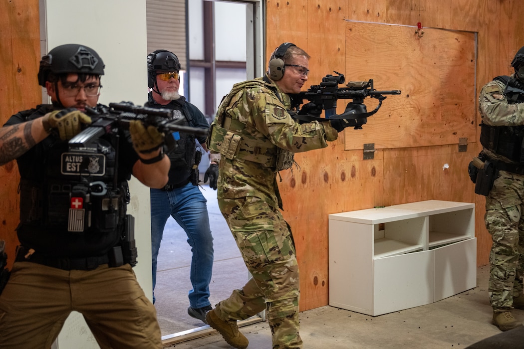 U.S. Air Force Col. Richard Kind, 97th Air Mobility Wing commander, conducts room-clearing procedures with 97th Security Forces Squadron members at Altus Air Force Base, Oklahoma, May 7, 2026. The demonstration gave the command team a hands-on look at the tactics and coordination Defenders use when responding to high-risk situations. (U.S. Air Force photo by Airman 1st Class Nathan Langston)