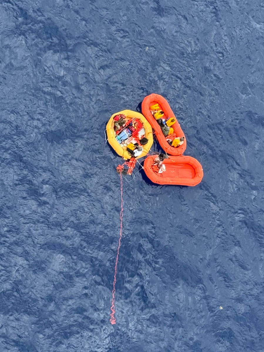 People floating in rescue water raft