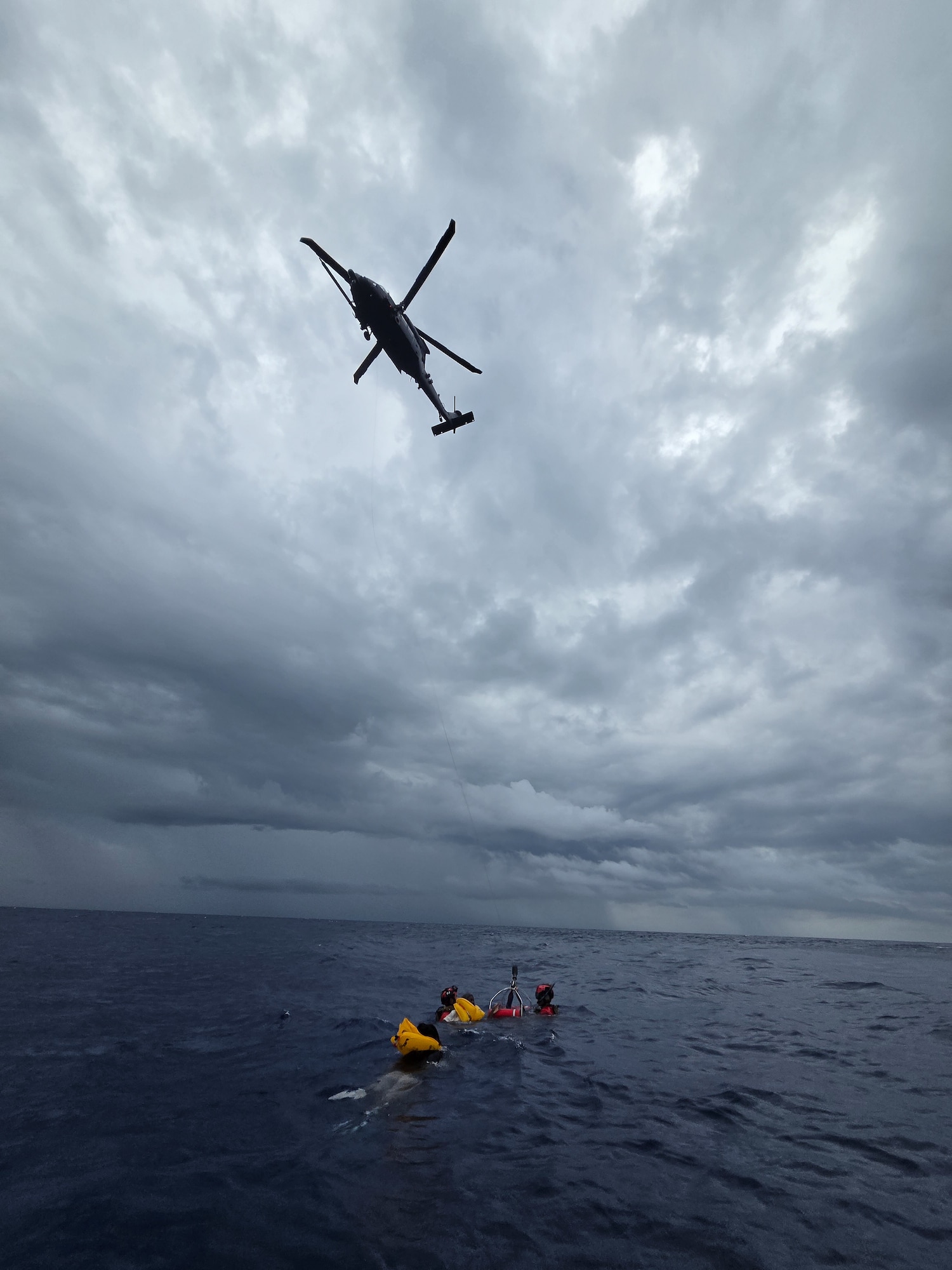 Helicopter hovering over ocean