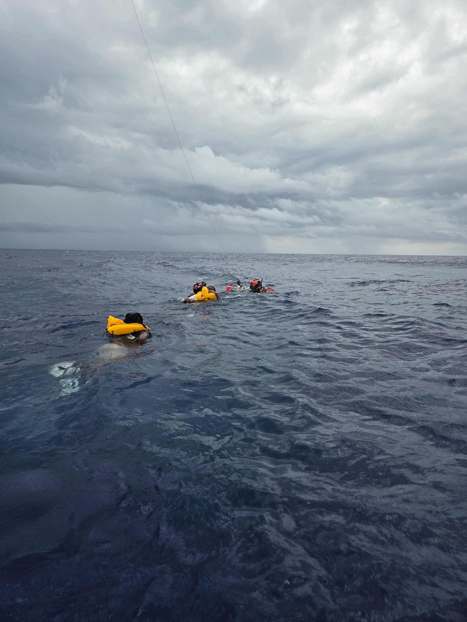 Pararescuemen float in water