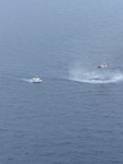 A Coast Guard Air Station Clearwater helicopter aircrew medevacs the captain of a fishing vessel 122 miles off Longboat Key, Florida, May 12, 2026.