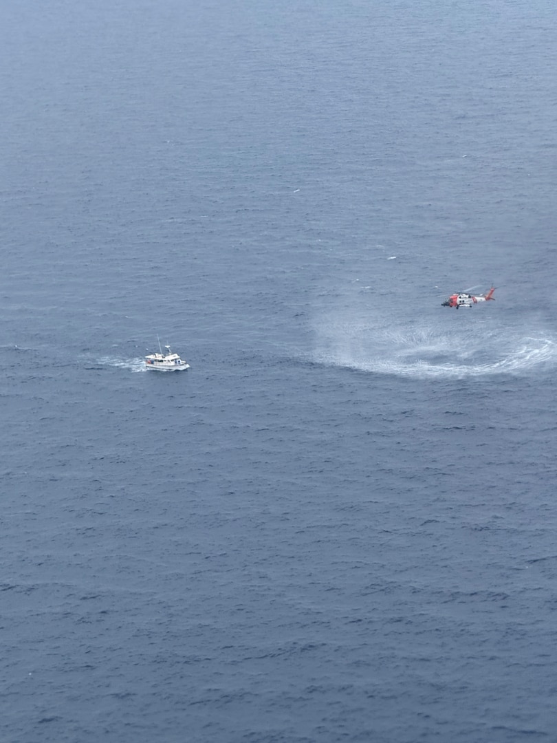 A Coast Guard Air Station Clearwater helicopter aircrew medevacs the captain of a fishing vessel 122 miles off Longboat Key, Florida, May 12, 2026.