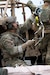 An Alaska Air National Guardsman assigned to the 212th Rescue Squadron, 176th Wing, prepares an intravenous line while responding to a simulated mass-casualty incident during a full mission profile exercise at Joint Base Elmendorf-Richardson, Alaska, Oct. 13, 2021. The busiest rescue force in the Department of Defense, the 212th RQS provides elite pararescuemen and combat rescue officers that are uniquely skilled in integrating air and ground capabilities to carry out the 176th Wing’s wartime and peacetime personnel recovery missions. (U.S. Air Force photo by Alejandro Peña)