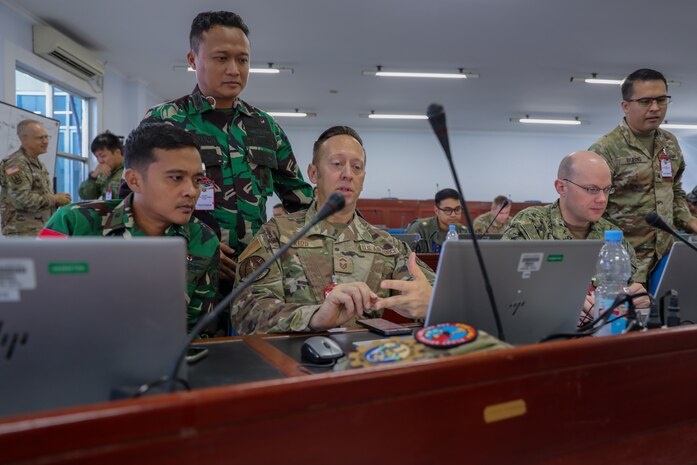 Joint and multilateral military personnel converse at a Joint Staff Exercise during Super Garuda Shield 25 in Jakarta, Indonesia, Aug. 29, 2025.