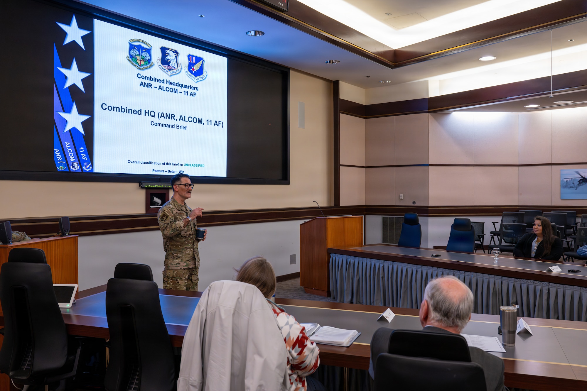 U.S. Air Force Brig. Gen. Matthew Komatsu, Air National Guard Assistant to the Commander, Alaskan Command, and Alaska Air National Guard Chief of Joint Staff, briefs members of the Business Executives for National Security organization during an installation visit at the combined headquarters Alaskan NORAD Region, Alaskan Command, and Eleventh Air Force at Joint Base Elmendorf-Richardson, Alaska, May 4, 2026. Komatsu briefed the missions of the combined headquarters, discussing each commands’ roles and responsibilities in defending the homeland. (U.S. Air Force photo by Senior Airman Tala Hunt)