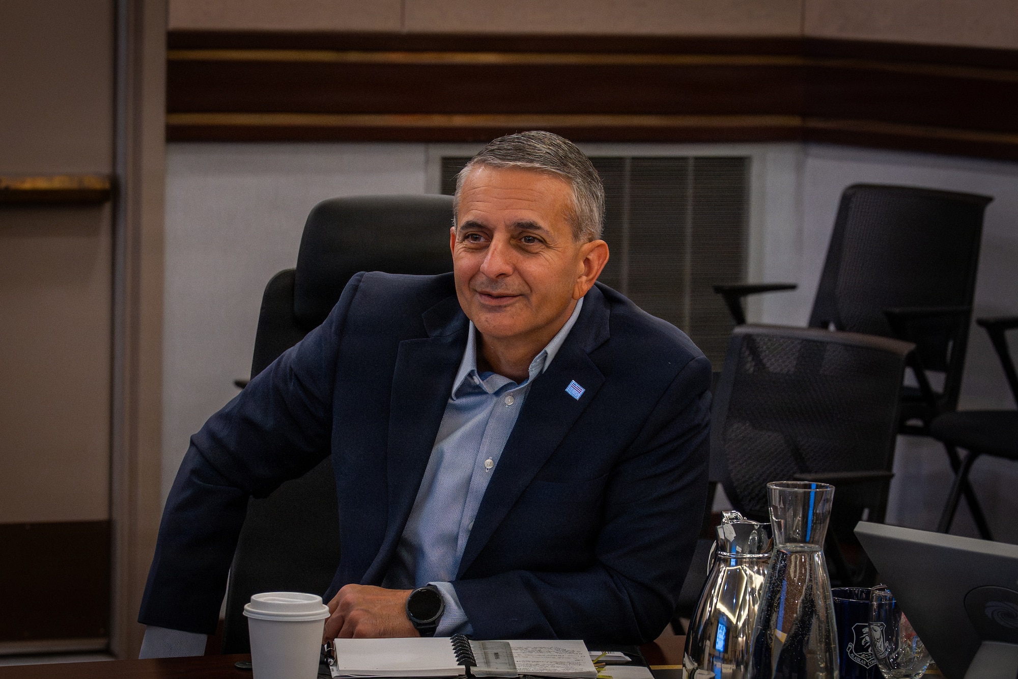 Retired U.S. Air Force Lt. Gen. Dave Julazadeh, Business Executives for National Security, chief operating officer, engages in conversation with peers during a briefing at the combined headquarters Alaskan NORAD Region, Alaskan Command, and Eleventh Air Force at Joint Base Elmendorf-Richardson, Alaska, May 4, 2026. BENS is a nonprofit organization, founded in 1982, consisting of business executives and entrepreneurs who use their business experience to help address the United States’ pressing national security challenges. (U.S. Air Force photo by Senior Airman Tala Hunt)