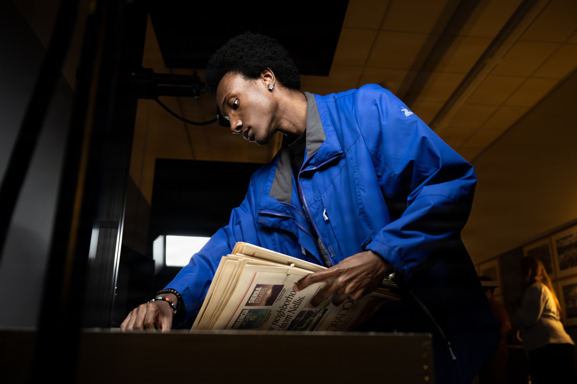 a person sorts through files