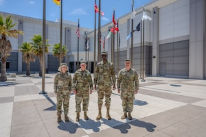 U.S. Space Force Lt. Gen. Dennis O. Bythewood, commander of U.S. Space Forces - Space (S4S) and the Combined Joint Force Space Component, second from left, poses for a photo with Brig. Gen. Jacob Middleton, commander of U.S. Space Forces - Europe and Africa (USSPACEFOR-EURAF), third from left, at S4S Headquarters, Vandenberg Space Force Base, Calif., May 13, 2026. The visit served to strengthen the relationship between S4S and SPACEFOREUR-AF leadership, while developing a better understanding of how the two component field commands can improve operation integration in support of joint missions with Allies and partners across the U.S. European Command and U.S. Africa Command areas of responsibility. By aligning theater-specific space requirements with S4S global command and control, the commanders ensure the Joint Force remains postured to Defend critical infrastructure and Deliver space effects across the continent. Pictured in the photo from left to right: Chief Master Sgt. Tina Timmerman, S4S command senior enlisted leader; Lt. Gen. Bythewood; Brig. Gen. Jacob Middleton; Chief Master Sgt. Alex Birkle, USSPACEFOR-EURAF command senior enlisted leader. (U.S. Space Force photo by David Dozoretz)