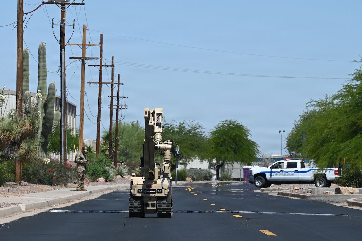 U.S. Air Force Staff Sgt. Matthew Blaquiere, 355th Civil Engineer Squadron explosive ordnance disposal technician, navigates a T7 robotic platform toward a simulated abandoned vehicle with reported munitions during exercise Mosaic Lightning 26-2 at Davis-Monthan Air Force Base, Arizona, May 8, 2026. High-intensity, realistic combat readiness exercises like Mosaic Lightning push Warfighters to their limits, building the muscle memory and confidence needed for combat. (U.S. Air Force photo by Staff Sgt. Kahdija Slaughter)