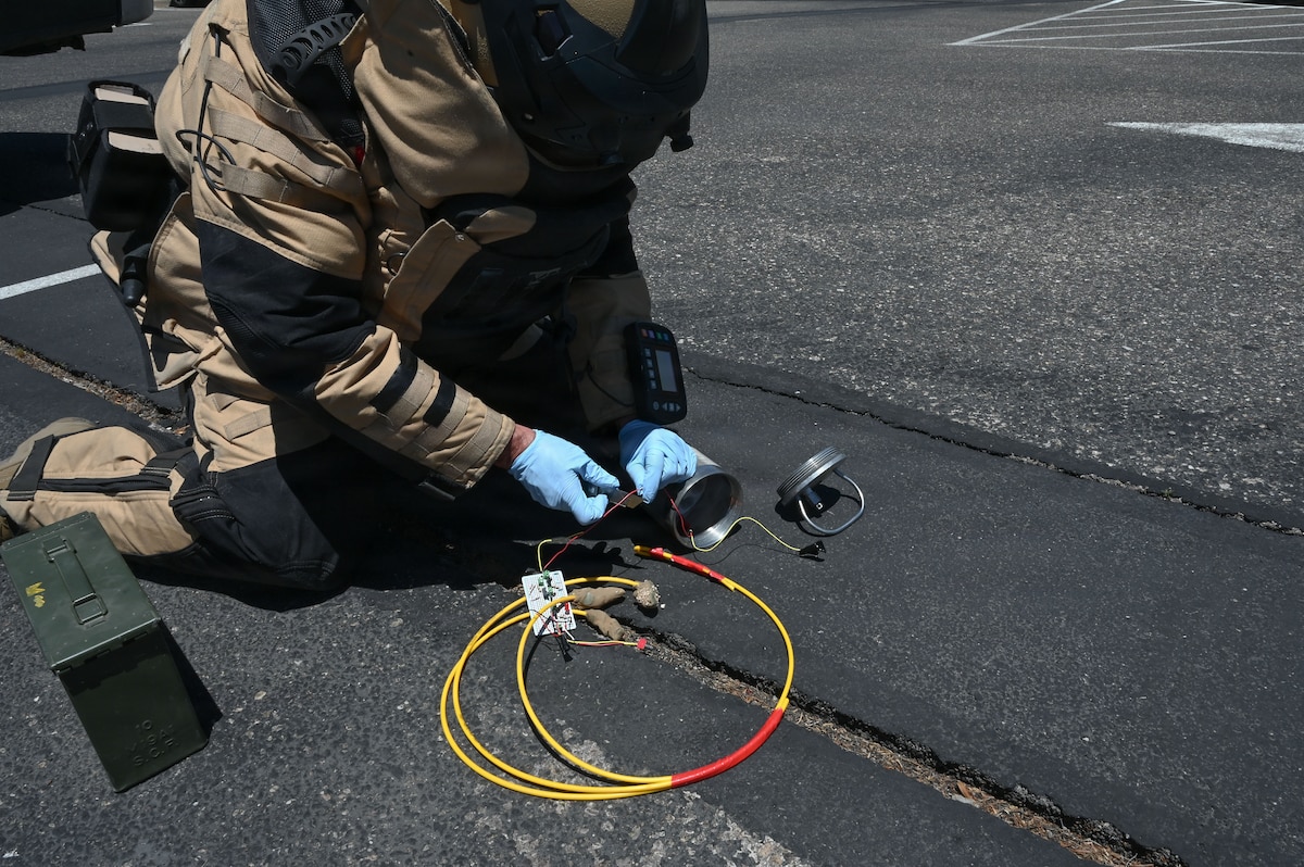 U.S. Air Force Tech. Sgt. Bruce Noble, 355th Civil Engineer Squadron explosive ordnance disposal team leader, separates initiators from simulated bulk explosives during exercise Mosaic Lightning 26-2 at Davis-Monthan Air Force Base, Arizona, May 8, 2026. Relentless training and operational focus ensure Airmen are ready to meet any challenge with precision and professionalism. (U.S. Air Force photo by Staff Sgt. Kahdija Slaughter)
