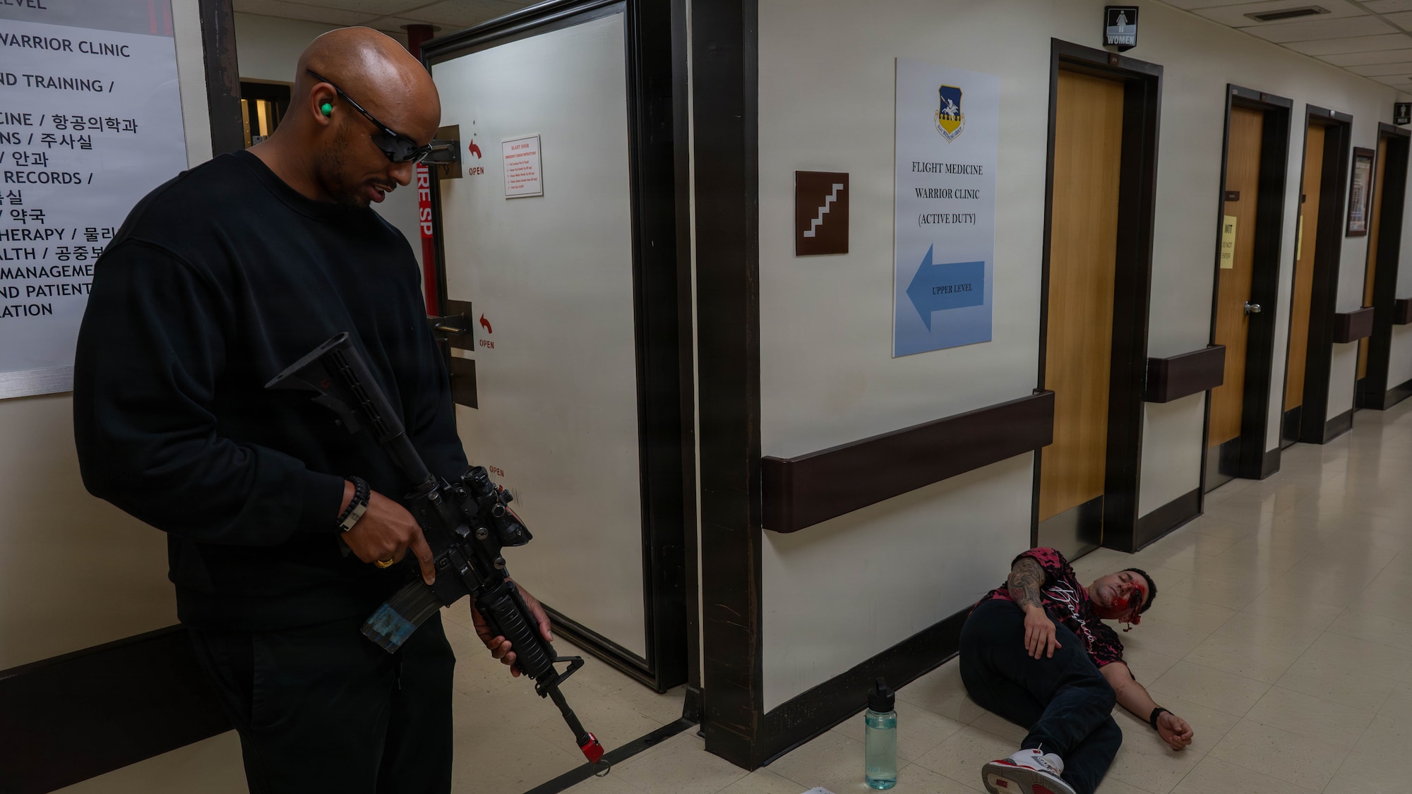U.S. Airmen assigned to the 51st Fighter Wing participate in an active shooter scenario during exercise Mustang Rodeo 26-2 at Osan Air Base, Republic of Korea, May 12, 2026. Mustang Rodeo 26-2 is a smaller scale training event designed to strengthen contingency response skills through focused, scenario-based training. (U.S. Air Force photo by Airman 1st Class Megan Cusmano)