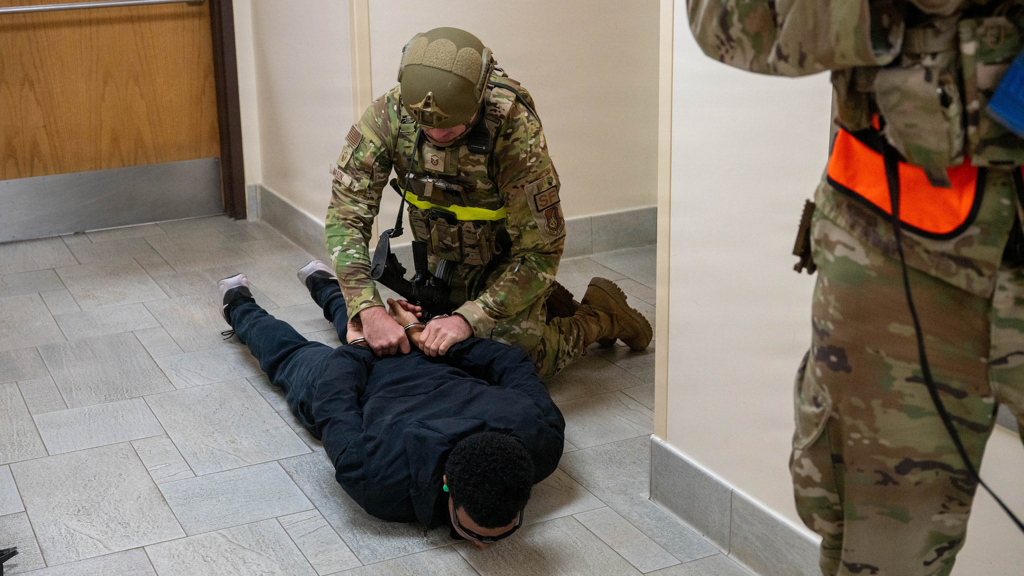 U.S. Airmen assigned to the 51st Security Forces Squadron detain a simulated active shooter during exercise Mustang Rodeo 26-2 at Osan Air Base, Republic of Korea, May 12, 2026. Mustang Rodeo 26-2 bridges the gap between large-scale exercises by providing Airmen regular opportunities to rehearse critical tasks under simulated operational stress. (U.S. Air Force photo by Airman 1st Class Megan Cusmano)