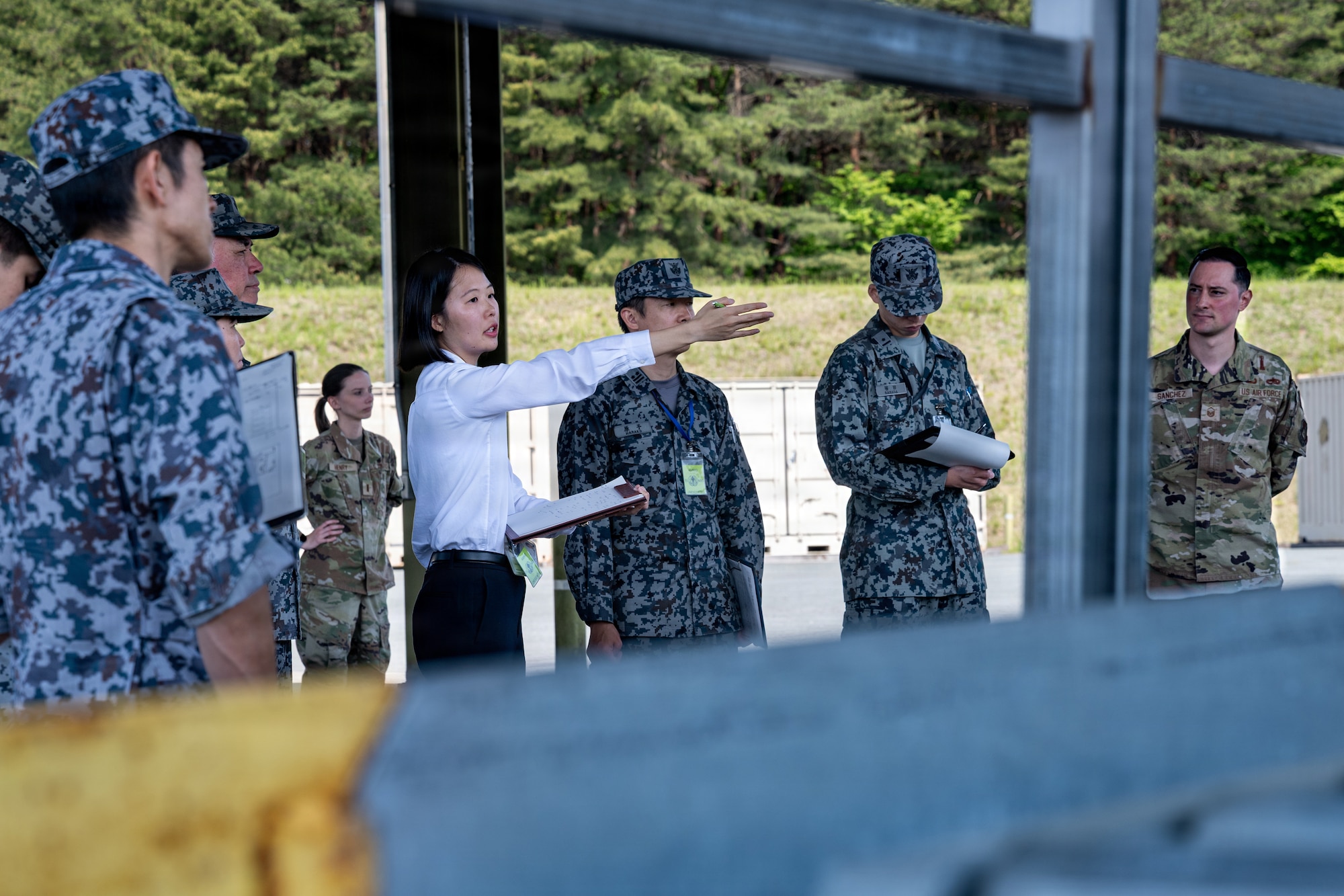 Japan Air Self-Defense Force airmen assigned to the 3rd Air Wing learn about the U.S. Air Force 35th Munition Squadron’s ammunition loading methods during an immersion tour.