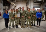 Sailors assigned to Naval Medical Center San Diego’s Medical Logistics Warehouse pose for a group photo after receiving the Navy & Marine Corps Fisher House Volunteer of the Year award at NMCSD, May 7, 2026. The mission of NMCSD is to optimize health and enhance readiness. NMCSD employs more than 5,500 active-duty military personnel, civilians, and contractors in southern California to deliver exceptional care afloat and ashore. (U.S. Navy photo by Mass Communication Specialist 1st Class Marcus L. Stanley)