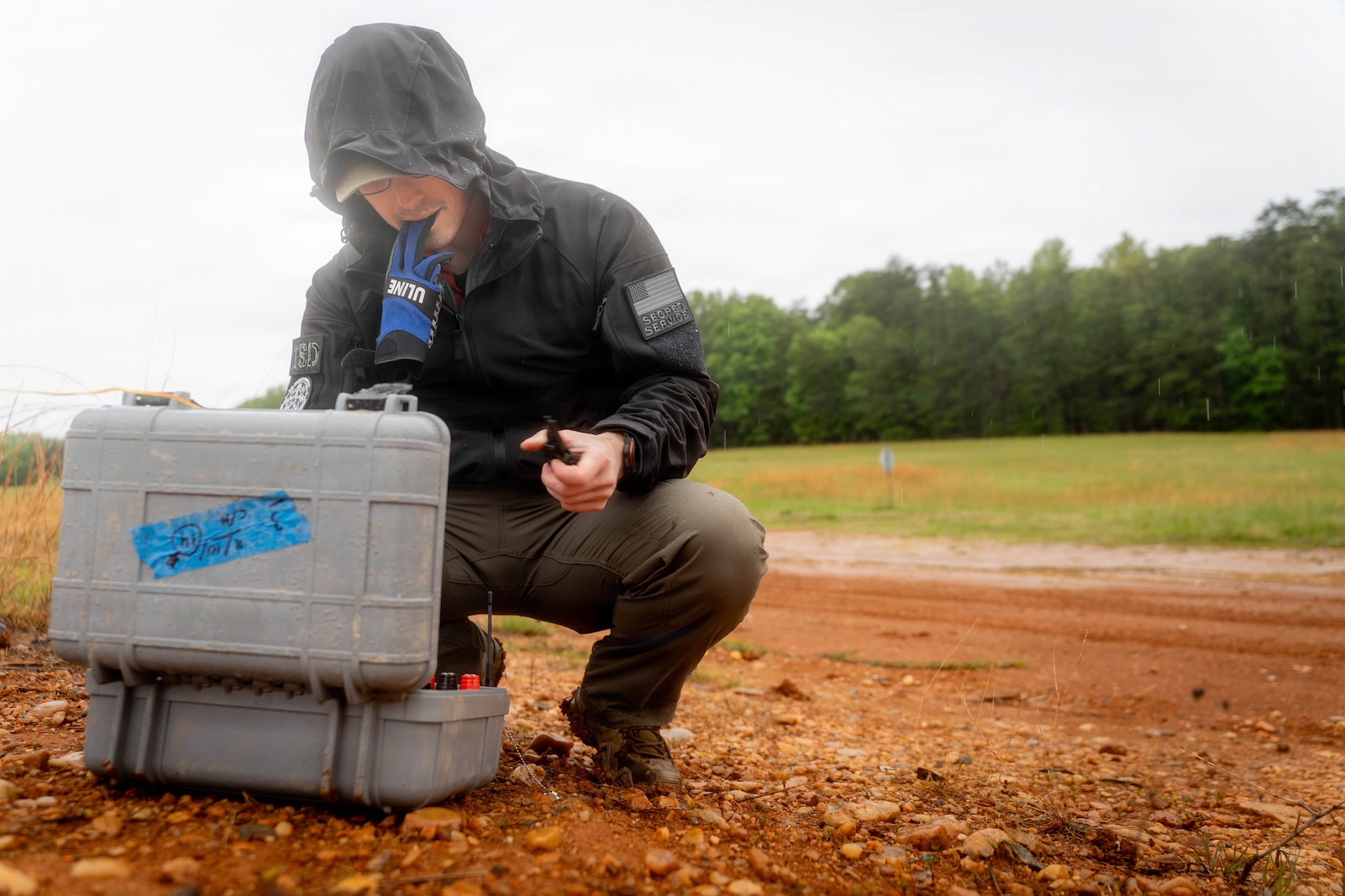 A United States Secret Service Special Agent, prepares wires for detonation on Marine Corps Base Quantico, May 11, 2026. This exercise showcased various explosive threats, including car bombs, pressure cooker bombs, explosive-vests, and C4, to help Secret Service and Department of Homeland Security employees better recognize and understand their effects. (U.S. Marine Corps photo by Cpl. Joshua Munsen)