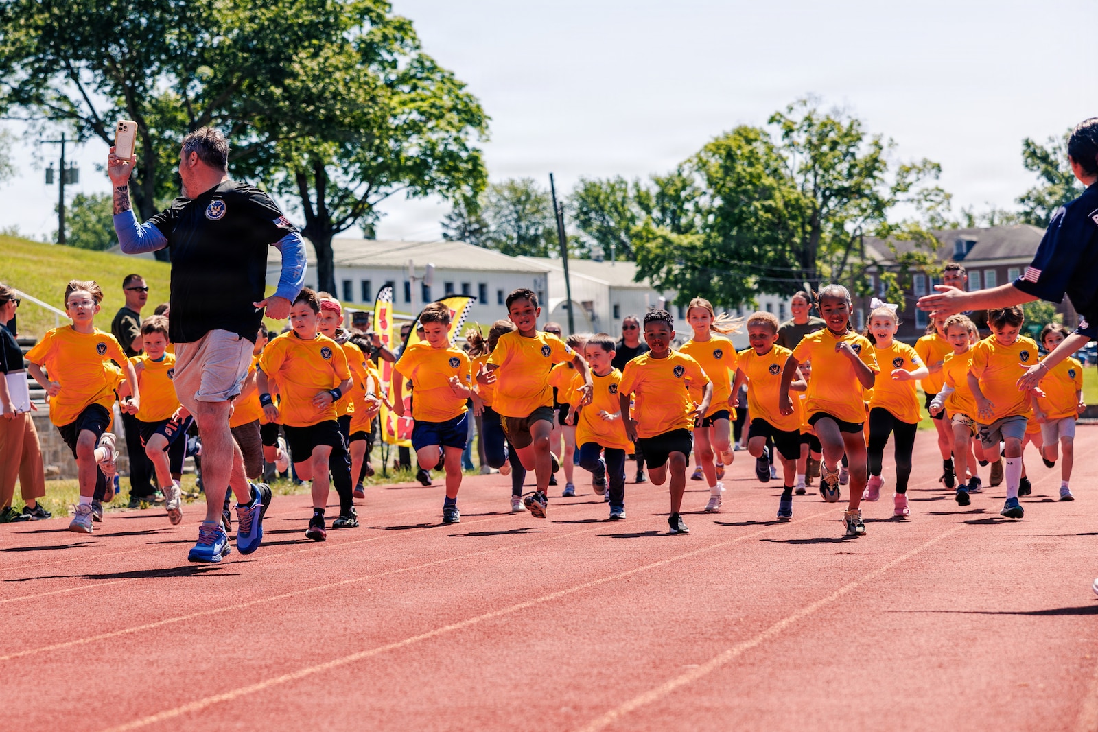 Students from Marine Corps Base Quantico’s Department of War Education Activity schools conduct the mile run event as part of the Presidential Fitness Test at Butler Stadium on MCB Quantico, Virginia, May 12, 2026. The Presidential Fitness Test consists of three fitness components that are designed to strengthen health, physical fitness, resilience, and establish lifelong healthy habits. The PFT also recognizes multiple levels of achievements, including the Presidential Fitness Award, National Fitness Award, Completion recognition and improvement.  (U.S. Marine Corps photo by Cpl. Braydon Rogers)