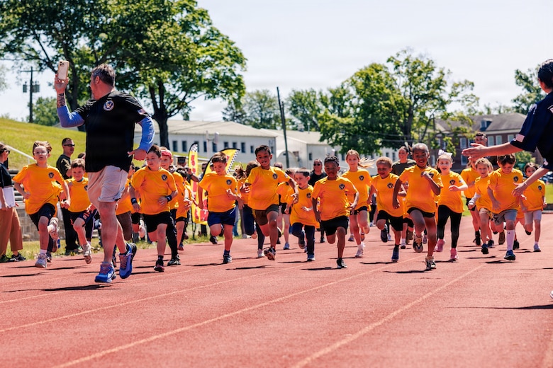 Students from Marine Corps Base Quantico’s Department of War Education Activity schools conduct the mile run event as part of the Presidential Fitness Test at Butler Stadium on MCB Quantico, Virginia, May 12, 2026. The Presidential Fitness Test consists of three fitness components that are designed to strengthen health, physical fitness, resilience, and establish lifelong healthy habits. The PFT also recognizes multiple levels of achievements, including the Presidential Fitness Award, National Fitness Award, Completion recognition and improvement.  (U.S. Marine Corps photo by Cpl. Braydon Rogers)