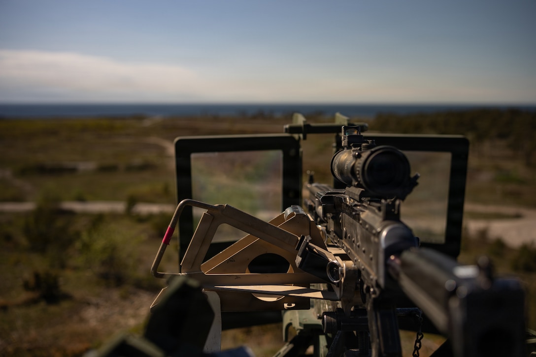 A M240B machine gun stands mounted on a medium tactical vehicle replacement during exercise Aurora 26 in Visby, May 10, 2026. U.S. Marines and Sailors with 2nd Marine Logistics Group are participating in exercise Aurora as part of the larger U.S. Army-led Sword 26 series of linked multinational exercises, which directly supports NATO's Eastern Flank Deterrence Initiative concept, validates defense plans, builds a unified lethal force, and strengthens deterrence. (U.S. Marine Corps photo by Lance Cpl. Talan Werner)