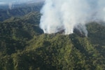 A Hawaii Army National Guard CH47 Chinook performs aerial fire suppression water bucket drops on the Island of Oahu in Mililani to assist the fight of wildfires, Mililani, Hawaii, November 1, 2023. (U.S. National Guard photo by Air Force Master Sgt. Andrew Jackson)
