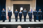 A group of new 433rd Airlift Wing and 960th Cyberspace Wing Non-Commissioned Officers pose for a photo at the Inter-American Air Forces Academy Auditorium before an NCO Induction Ceremony on Joint Base San Antonio-Lackland, Texas, on April 11, 2026. (U.S. Air Force photo by Master Sgt. Jacob Lewis)