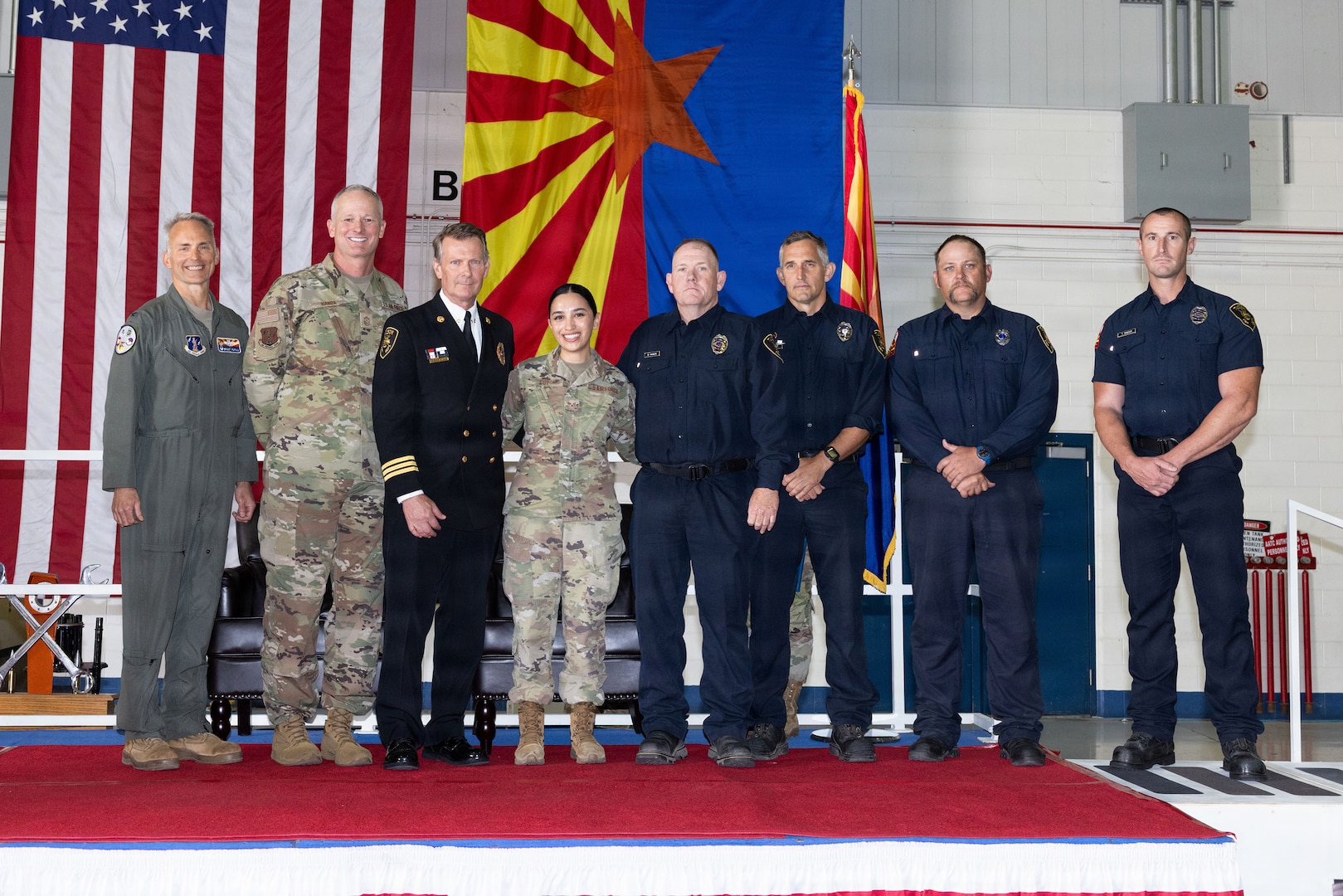 Senior Airman Nicolle Coy, an aerospace medical services specialist assigned to the Arizona National Guard's 162nd Wing Medical Group, receives recognition from leadership with the Tucson Fire Department during the Wing Annual Awards, May 3, 2026.