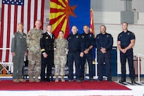 Senior Airman Nicolle Coy, an aerospace medical services specialist assigned to the Arizona National Guard's 162nd Wing Medical Group, receives recognition from leadership with the Tucson Fire Department during the Wing Annual Awards, May 3, 2026.