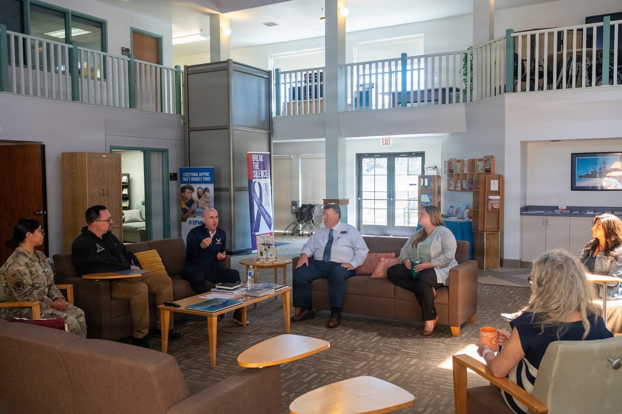 People sit around the lobby of the Military and Family Readiness Center.