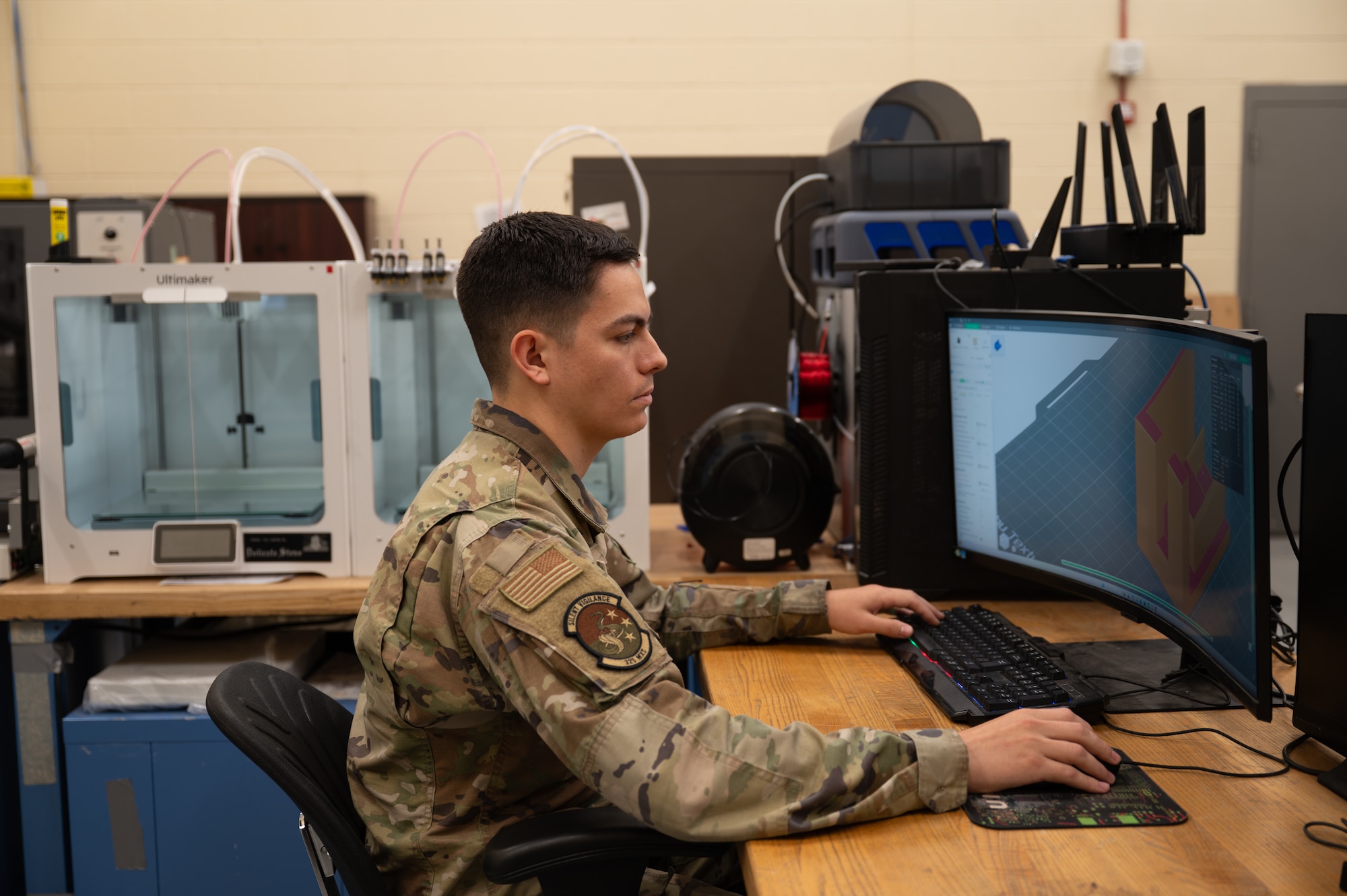 U.S. Air Force Senior Airman Andrew Collier, 325th Maintenance Squadron metals technology journeyman, uses computer-aided design software to engineer a missile loading table cover at Tyndall Air Force Base, Florida, April 22,