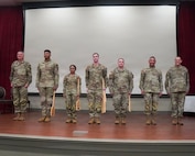 The 73rd (General Support) Military Intelligence Company, Headquarters and Headquarters Battalion, 10th Mountain Division (Light Infantry), Fort Drum, New York pose for a photo after winning first place during the Tranquil Storm 2026 awards ceremony at the Louisiana National Guard's Camp Beauregard April 30, 2026.