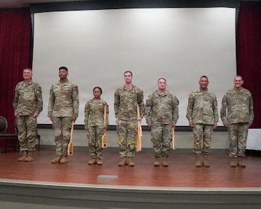 The 73rd (General Support) Military Intelligence Company, Headquarters and Headquarters Battalion, 10th Mountain Division (Light Infantry), Fort Drum, New York pose for a photo after winning first place during the Tranquil Storm 2026 awards ceremony at the Louisiana National Guard's Camp Beauregard April 30, 2026.