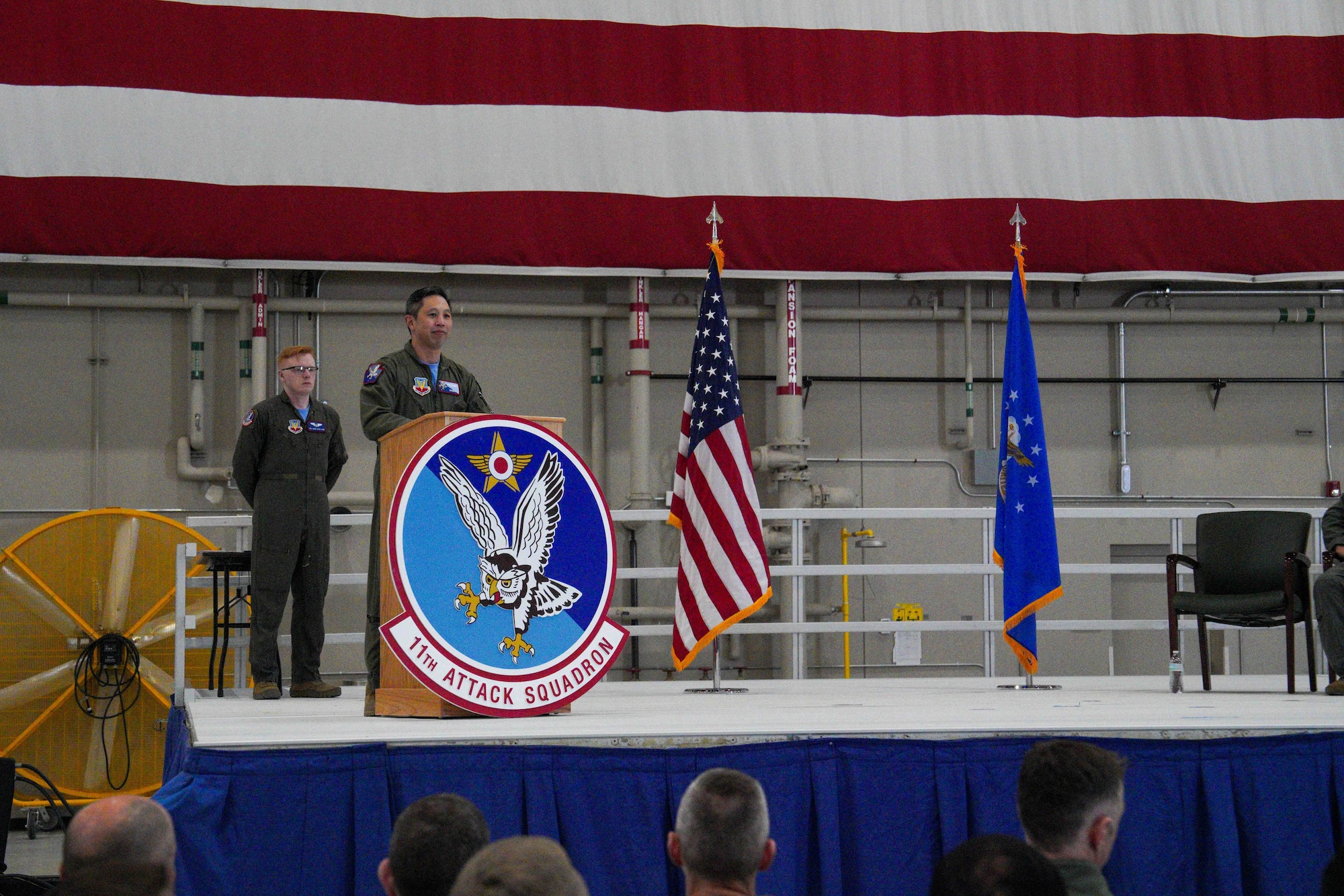 U.S. Air Force Col. Landon Quan, 25th Attack Wing deputy commander of operations, delivers opening remarks during the 11th Attack Squadron change of command ceremony at Creech Air Force Base, Nevada, April 17, 2026.