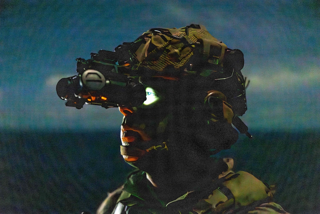 A U.S. Marine with Battalion Landing Team 3/5, 11th Marine Expeditionary Unit, scans for vessels on the flight deck of Wasp-class amphibious assault ship USS Boxer (LHD 4) while transiting the Balabac Strait, April 27, 2026. The 11th MEU, embarked aboard the Boxer Amphibious Ready Group, is a persistent, combat credible force contributing to deterrence and crisis response in the U.S. 7th Fleet area of operations. U.S. 7th Fleet, the U.S. Navy's largest forward-deployed numbered fleet, routinely interacts and operates with allies and partners to preserve a free and open Indo-Pacific. (U.S. Marine Corps photo by Sgt. Trent A. Henry)