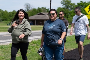 Woman smiles at camera on walk