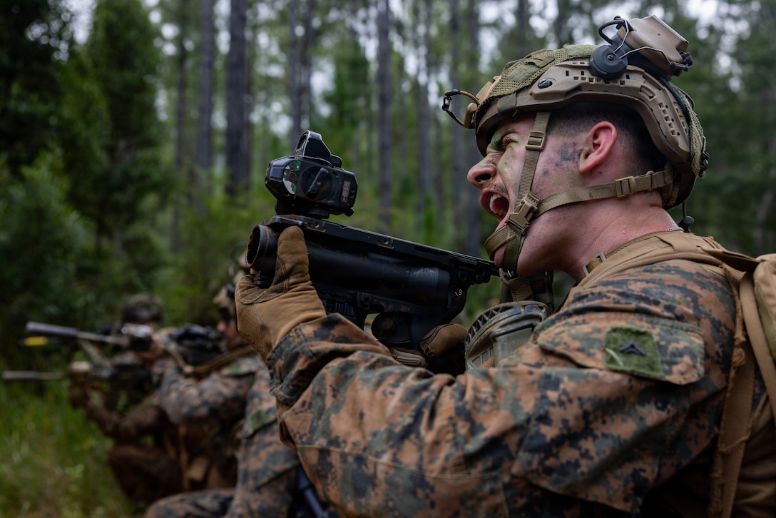 A U.S. Marine with Alpha Company, 1st Battalion, 5th Marine Regiment, Marine Rotational Force – Darwin, aims an M203 40 mm grenade launcher at simulated enemies during a patrol as part of Exercise Tagata Toa in Plum, New Caledonia, April 28, 2026. Exercise Tagata Toa 26 is a high-intensity, regimental-level, combined arms exercise hosted by the French Armed Forces in New Caledonia meant to enhance interoperability and strengthen relationships between nations operating in the South Pacific. (U.S. Marine Corps photo by Sgt. Kyle Chan)