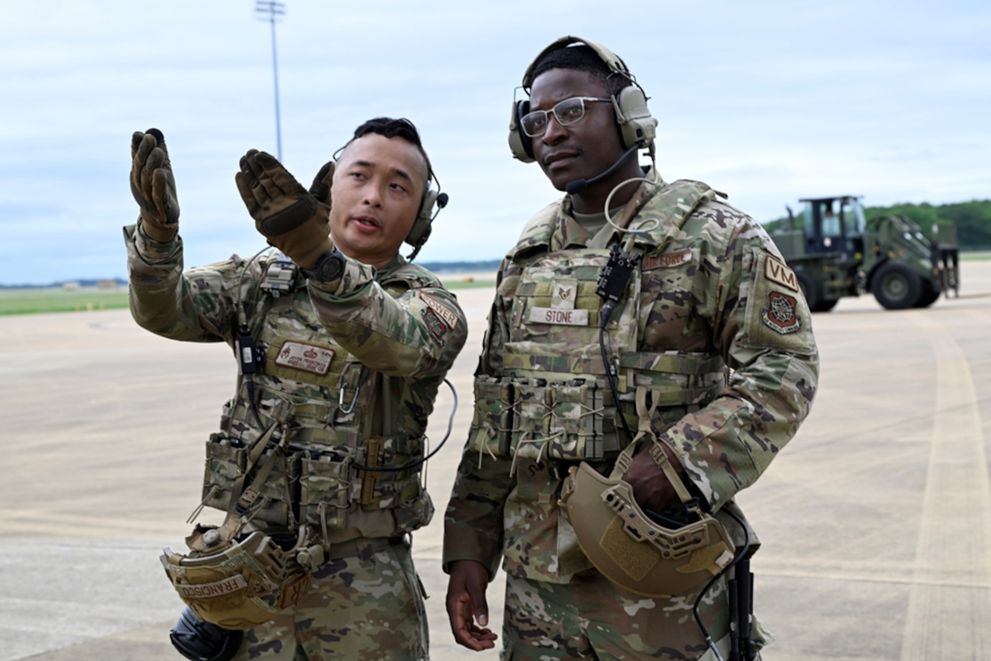 Men talk on the flightline.