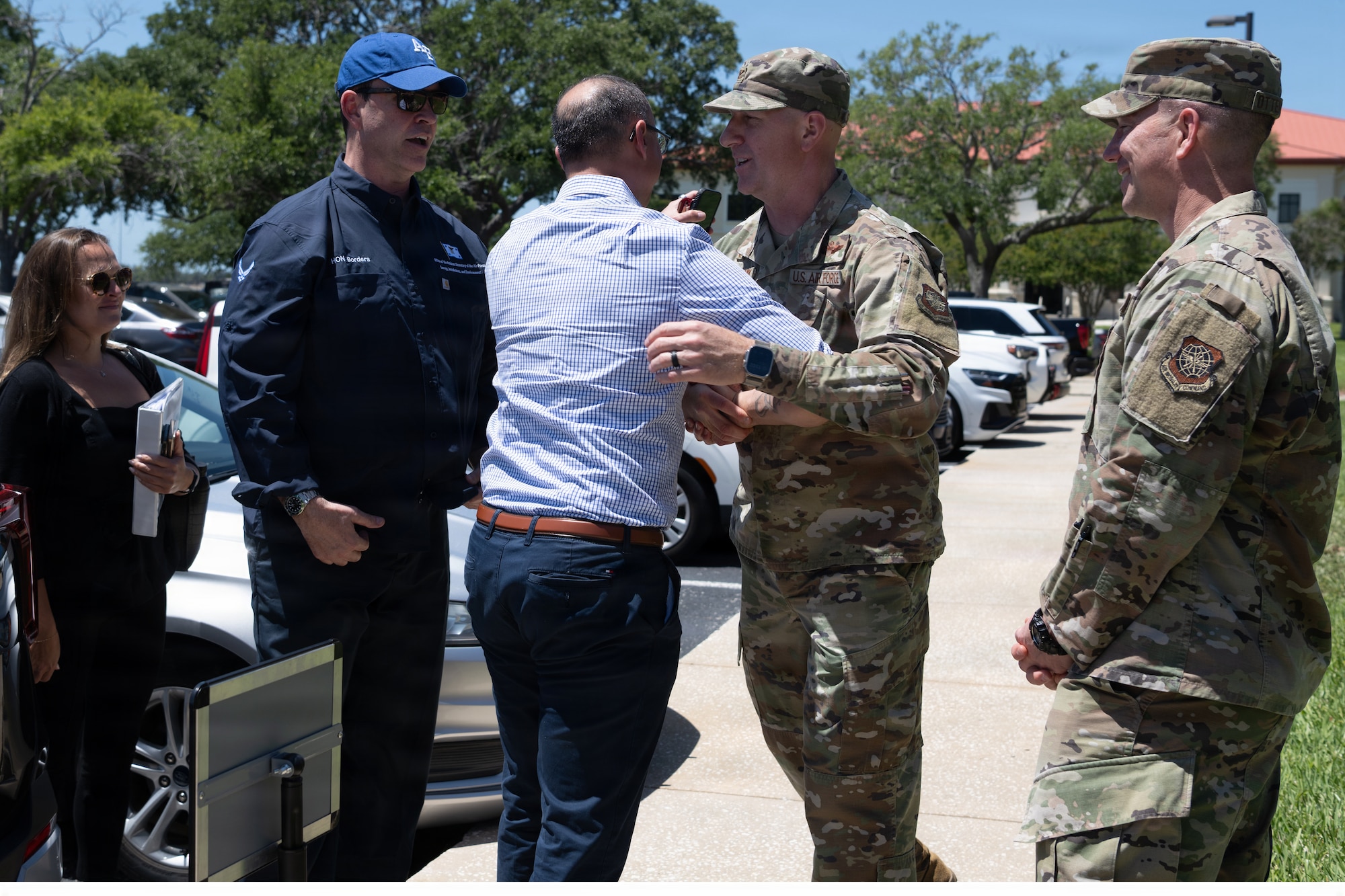 The Honorable Michael Borders, U.S. Assistant Secretary of the Air Force for Energy, Installations and Environment, (second from left) and his team are greeted by U.S. Air Force Col. Edward Szczpanik, 6th Air Refueling Wing commander and Chief Master Sgt. Christopher Ottenwess, 6th ARW command chief, upon arrival at MacDill Air Force Base, Florida, April 15, 2026. Borders visited the installation to receive an overview of base operations, with emphasis on housing and dormitory conditions supporting Airmen and their families. (U.S. Air Force photo by Airman Micquill Davis)
