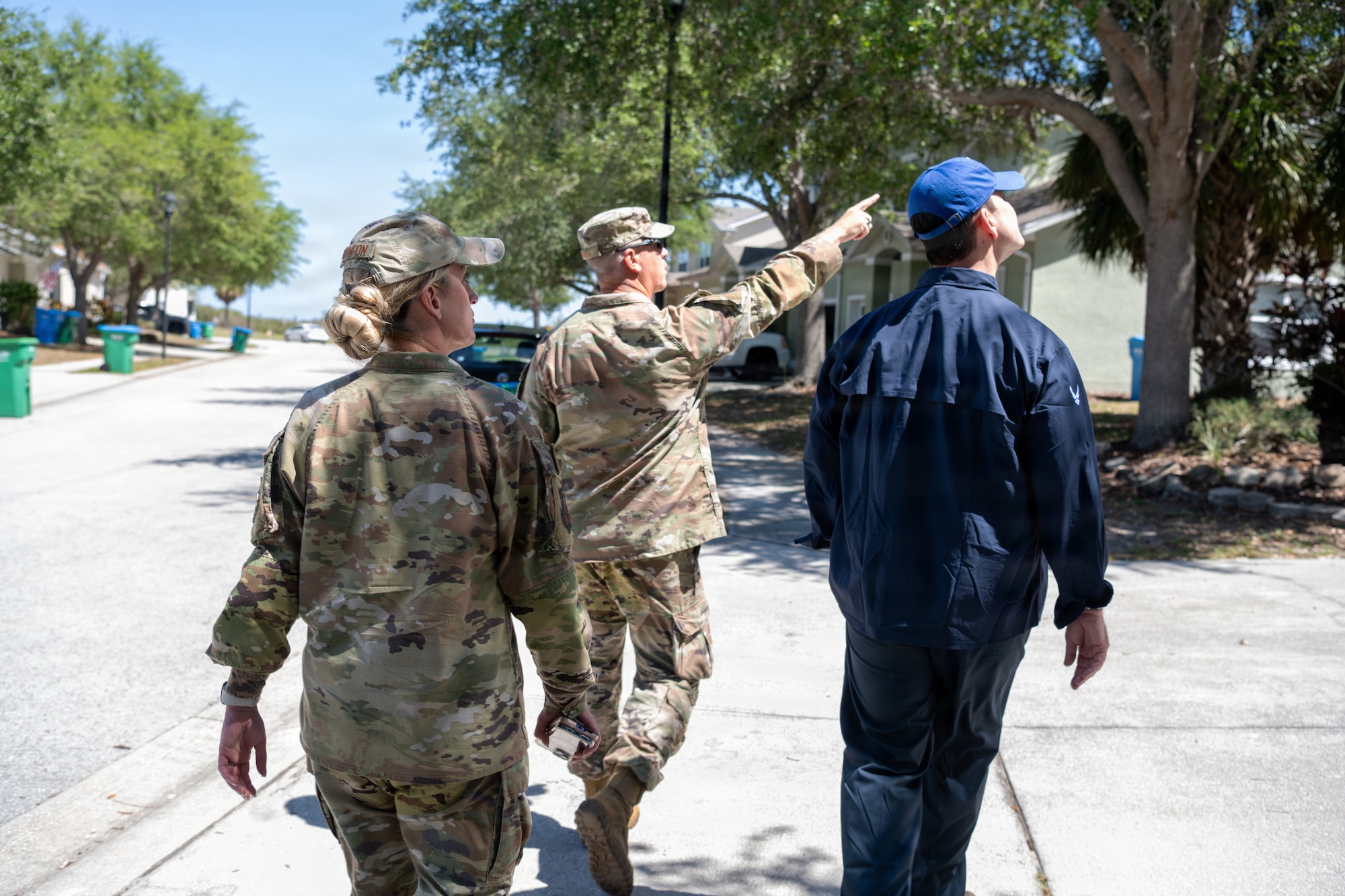 The Honorable Michael Borders, U.S. Assistant Secretary of the Air Force for Energy, Installations and Environment (right), tours base housing with Chief Master Sgt. Victoria Thornton, 6th Mission Support Group command chief (left) and Col. Robert Magee, 6th MSG commander at MacDill Air Force Base, Florida, April 15, 2026. The tour also included stops at the dormitories, hangars and Tinker Elementary School to evaluate conditions for Airmen and their families. (U.S. Air Force photo by Airman Micquill Davis)