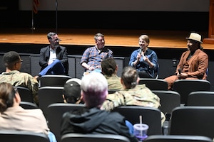 Woman speaks to audience.