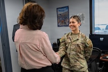 Lady Awarding coin to Lady