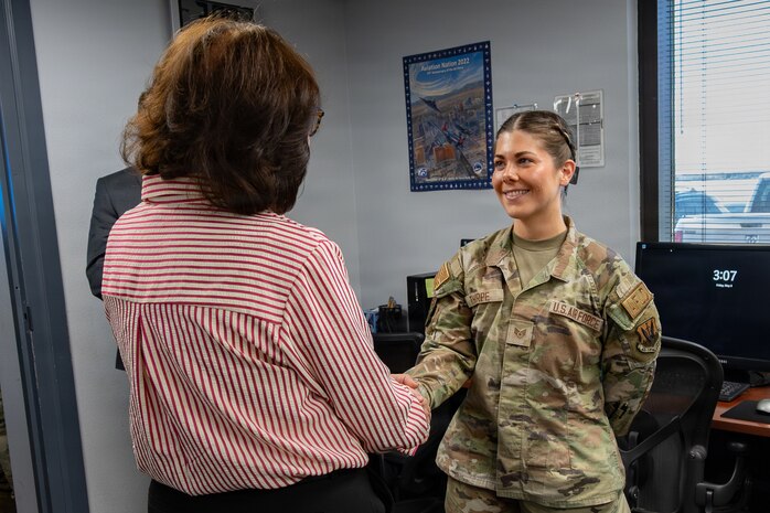 Lady Awarding coin to Lady